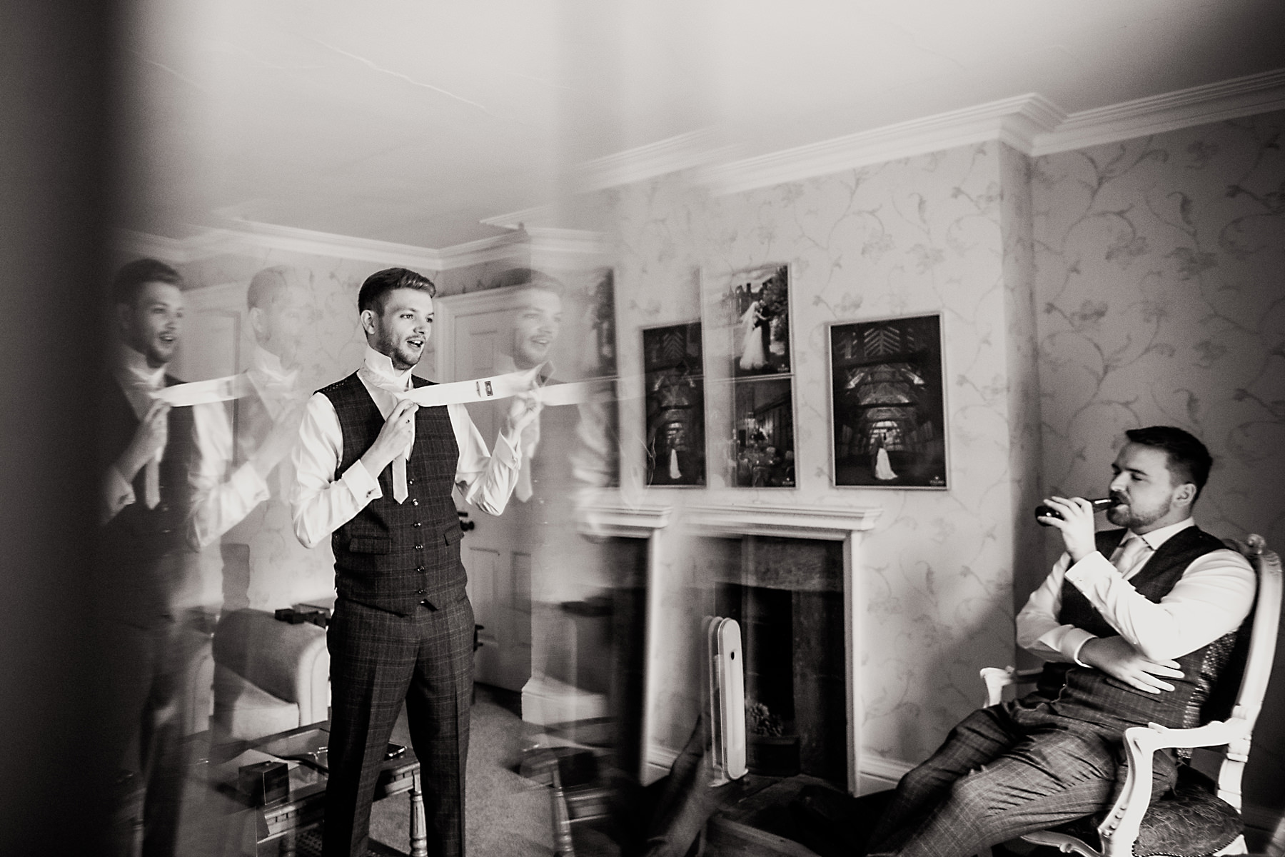 groom putting tie on