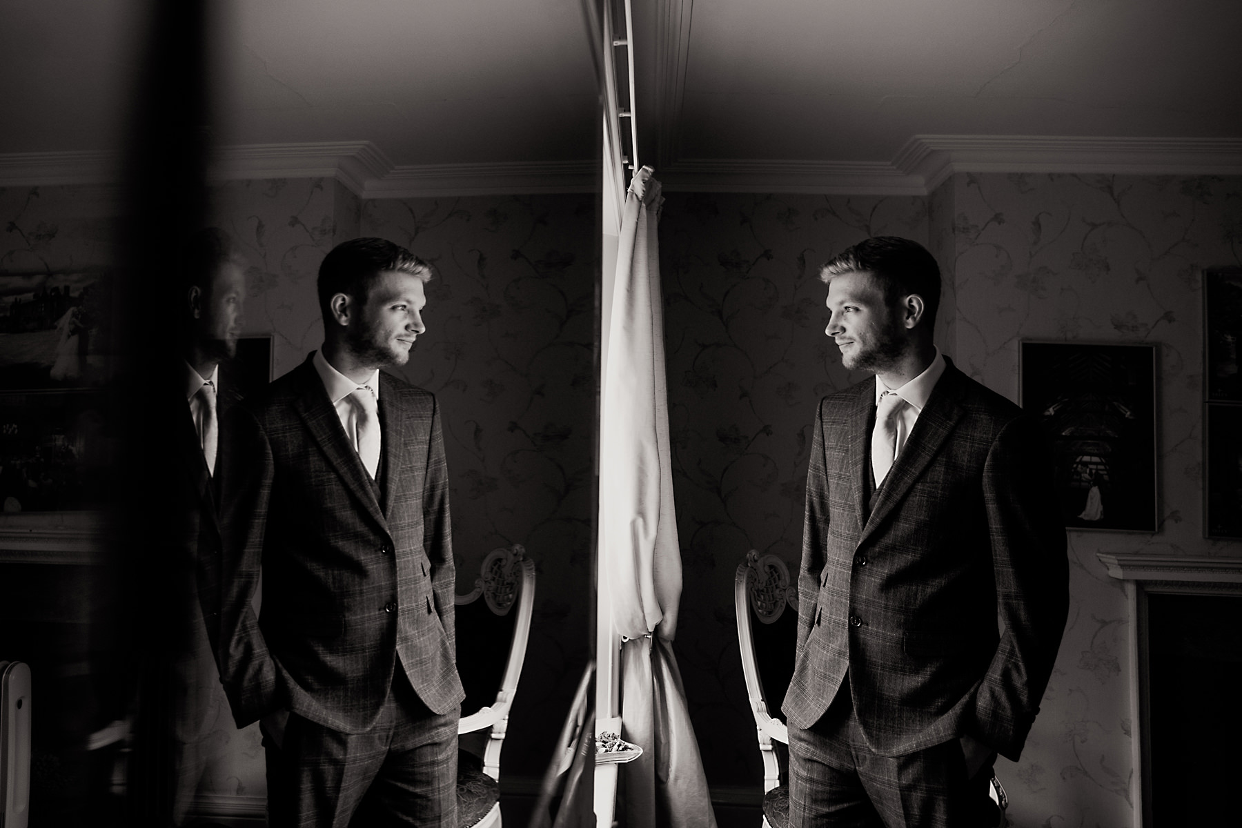 groom in window at arley hall