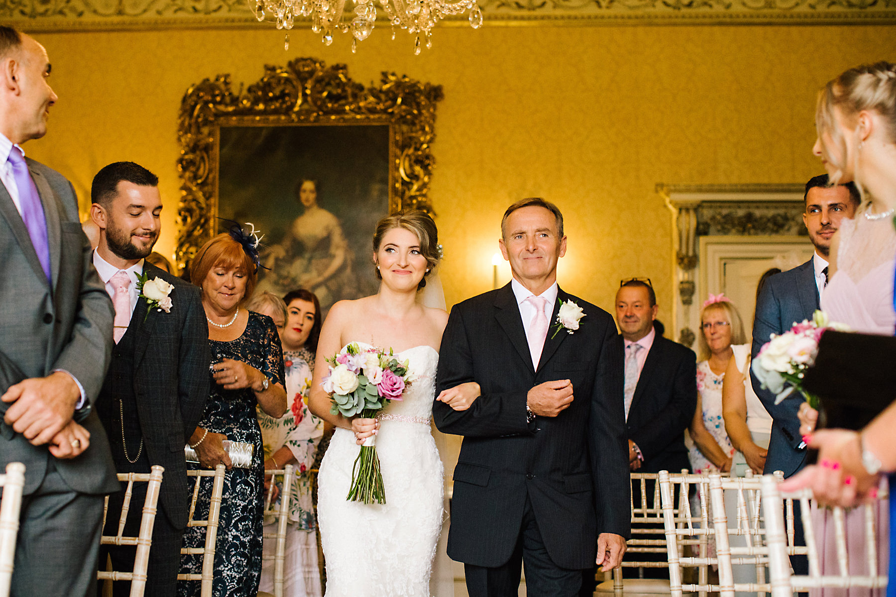 bride and dad walking down aisle at arley hall