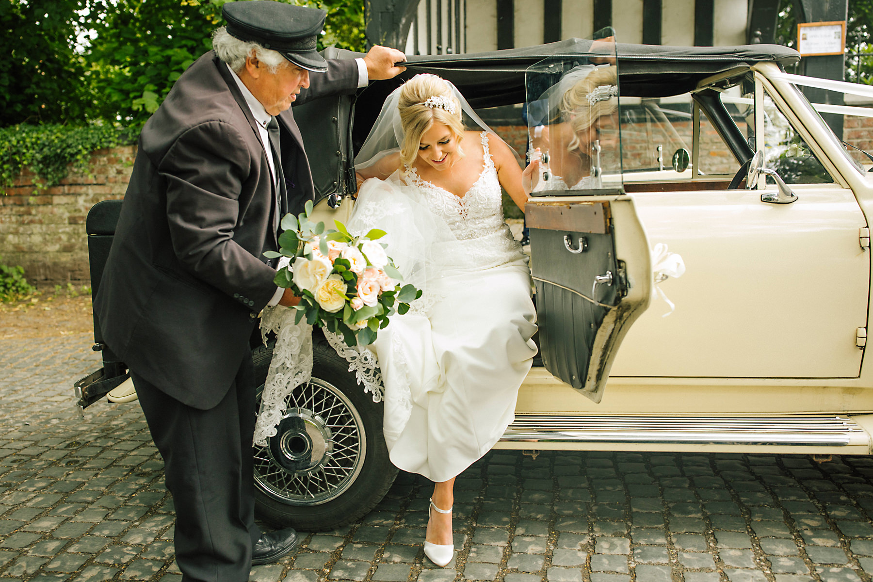 bride in vintage wedding car