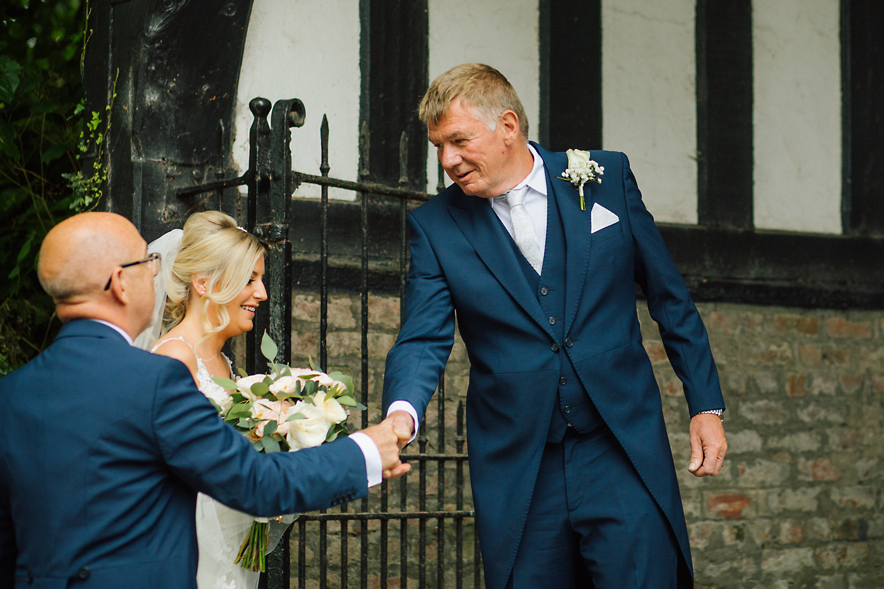 bride and father of the bride outside church