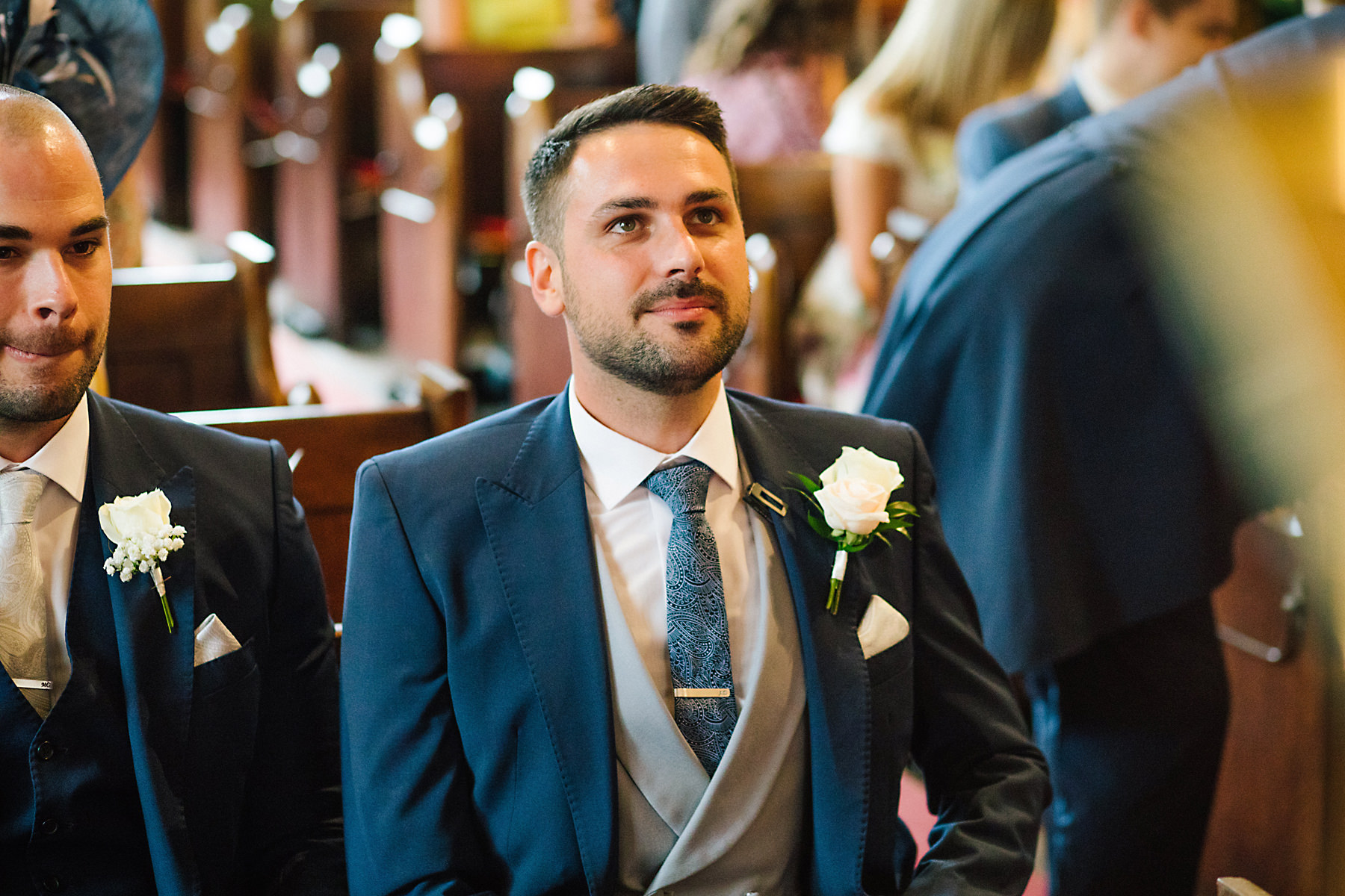 groom looking nervous in church