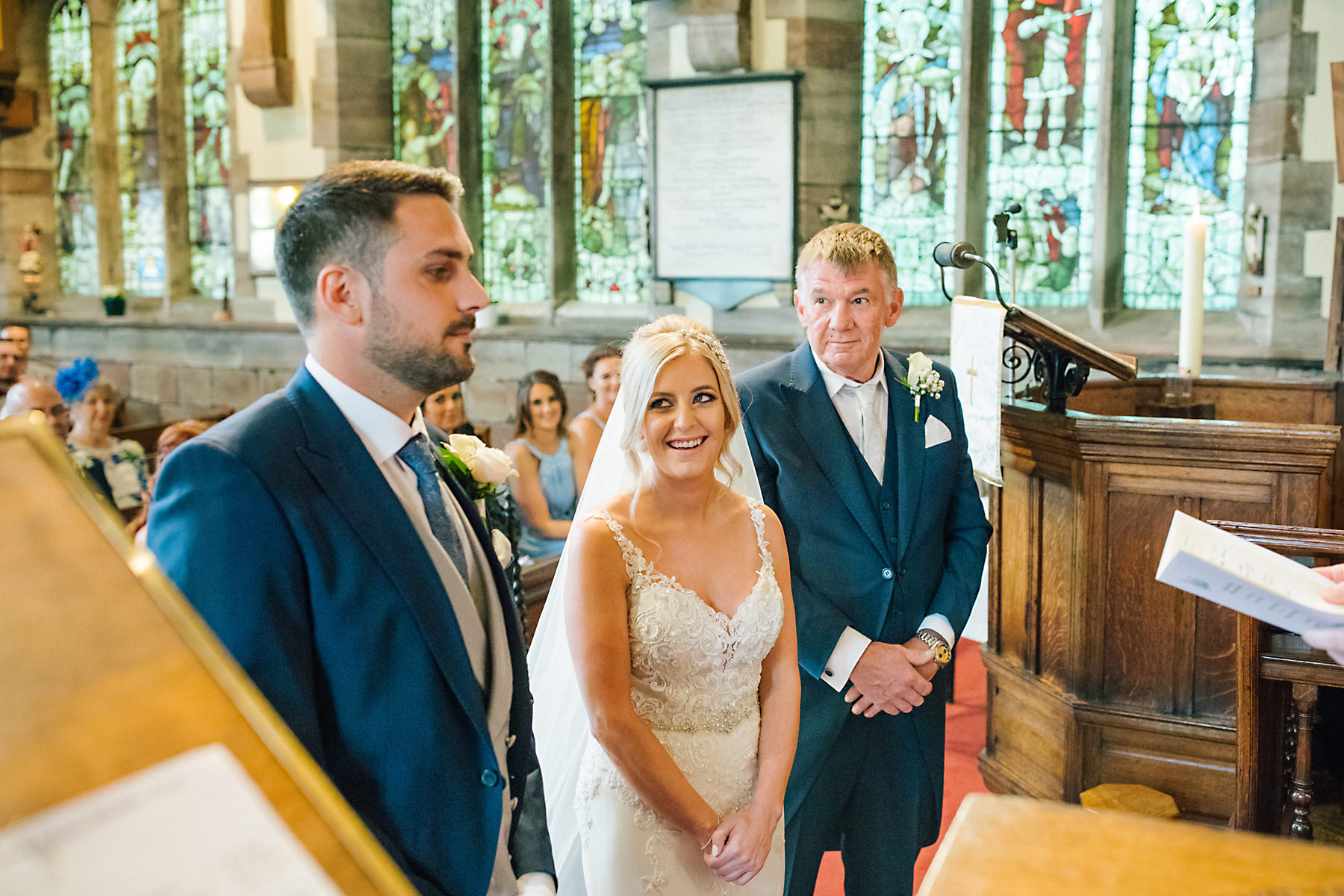 bride looking at groom in church