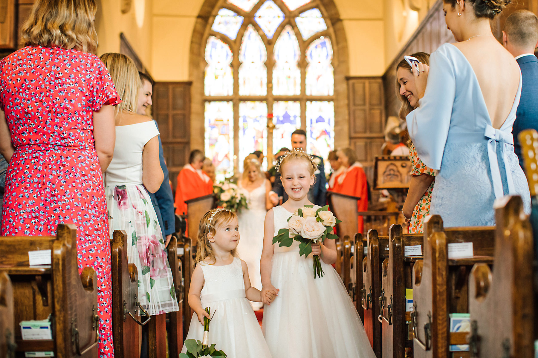 flower girls walking downtime aisle