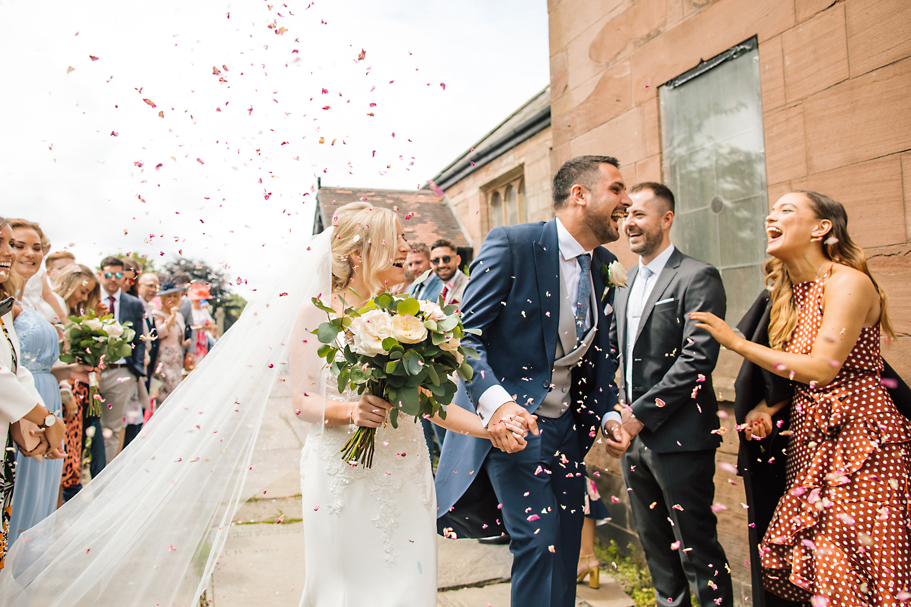 bride and groom confetti tunnel