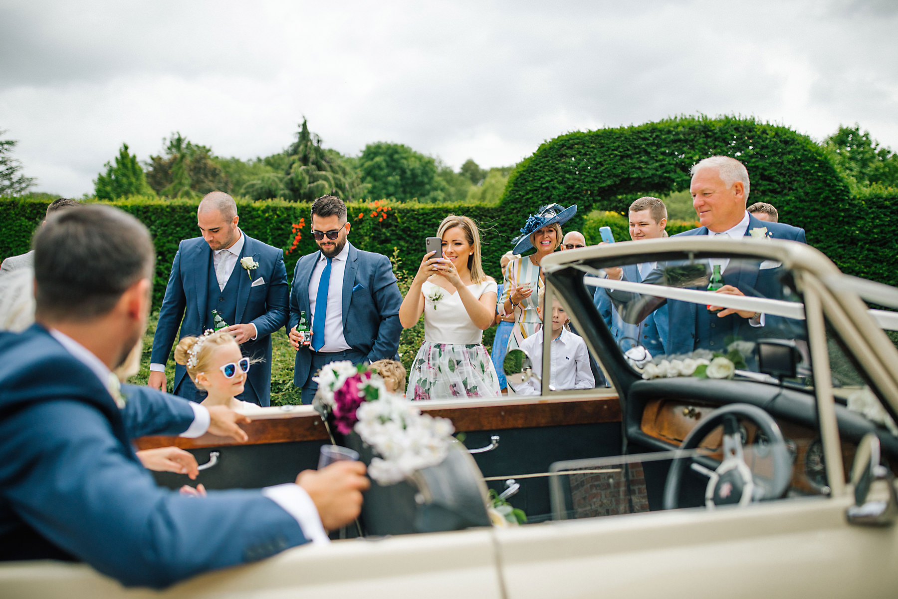 bride and groom arriving at holford estate