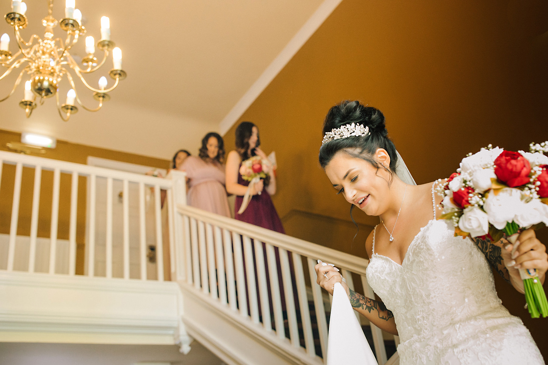 bride on staircase at chimney house hotel