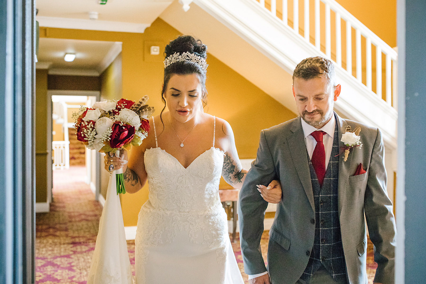 bride and dad walking down aisle