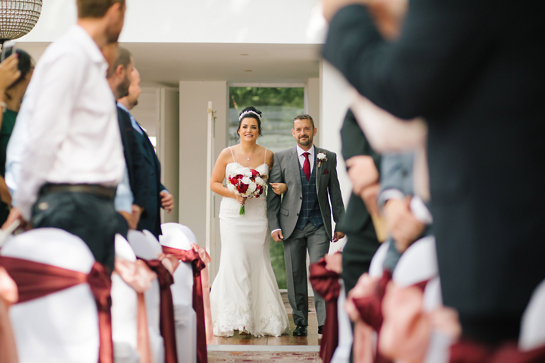 bride and dad walking down the aisle 