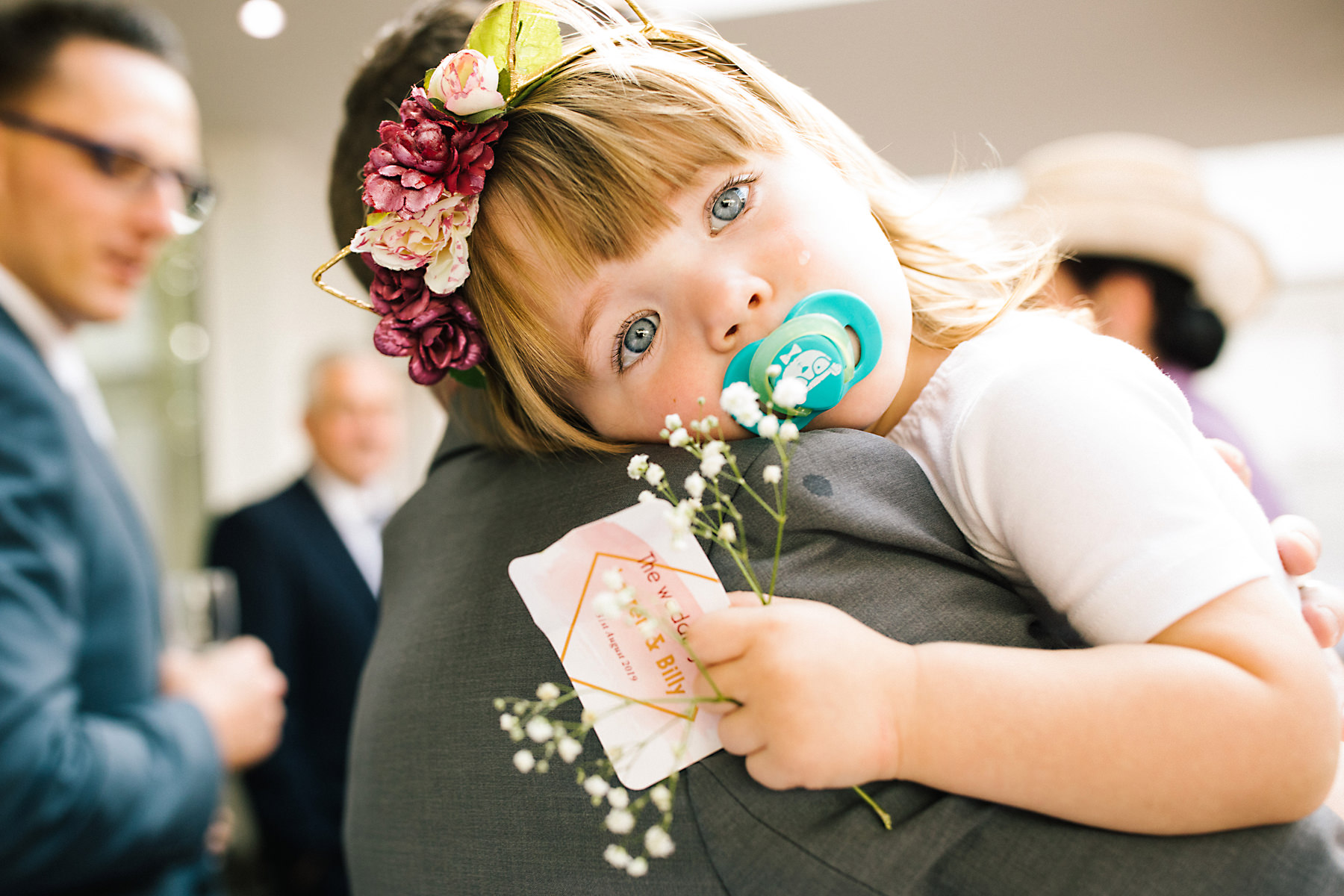 tired flowergirl at wedding
