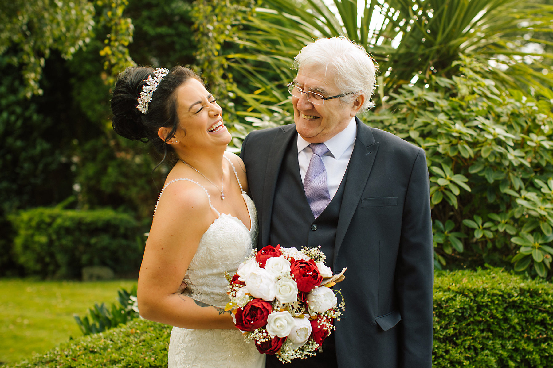 bride and grandad laughing
