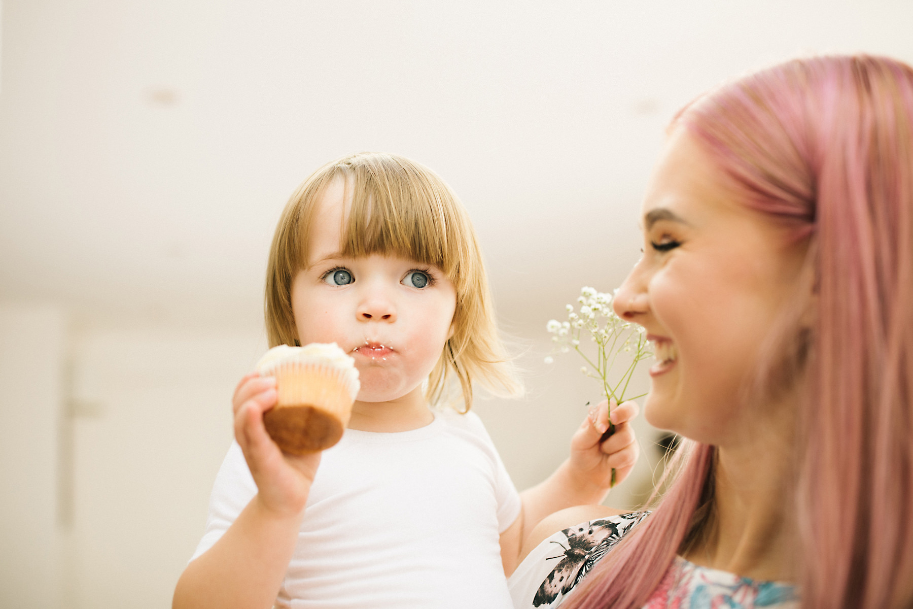 flowergirl eating wedding cake