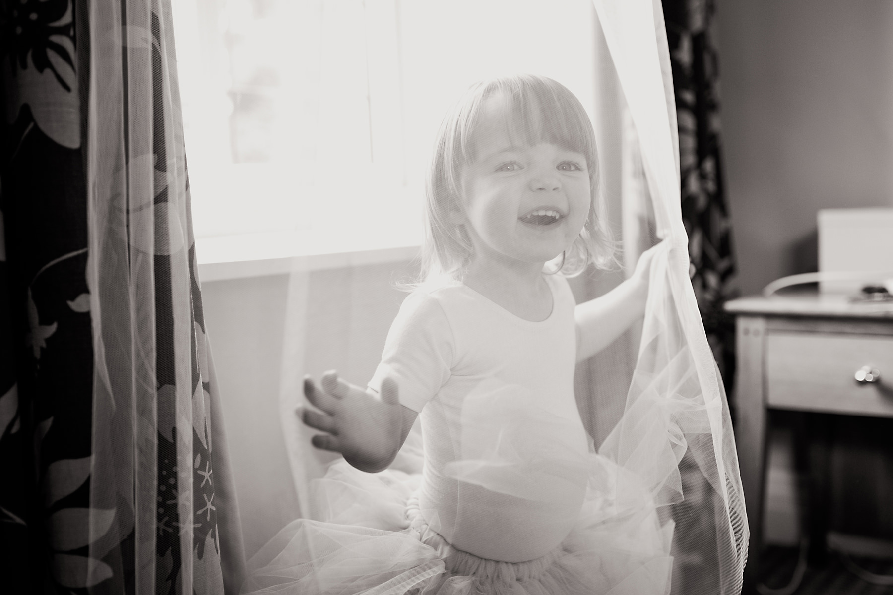 flowergirl playing with veil