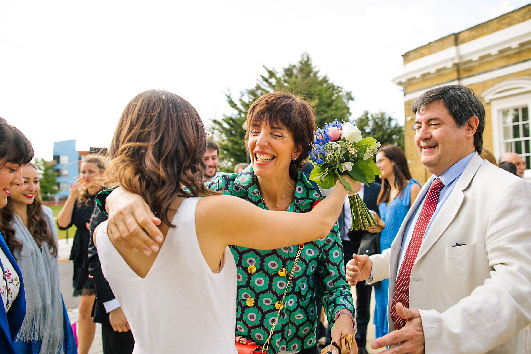 guests congratulating couple