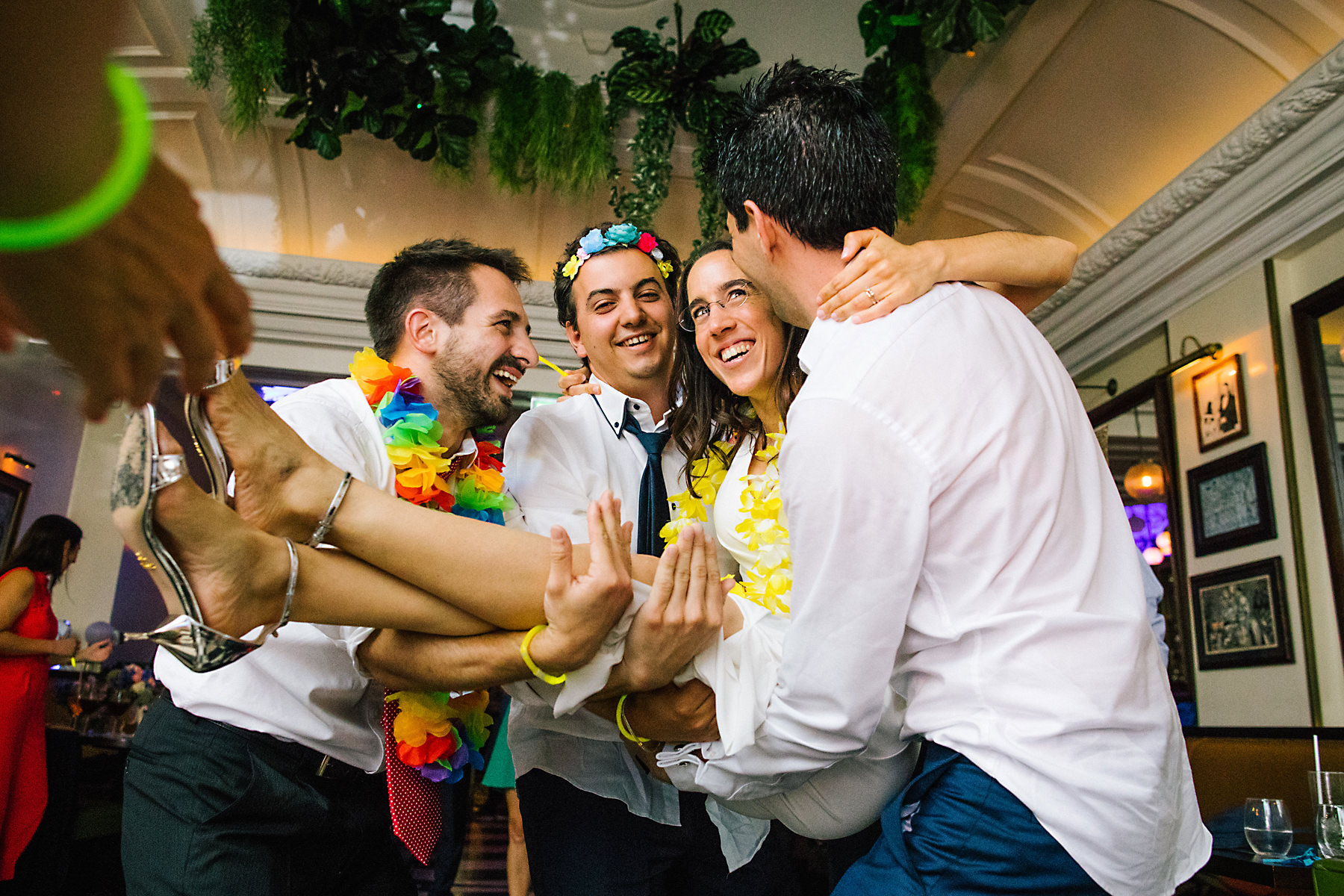bride thrown in air at wedding