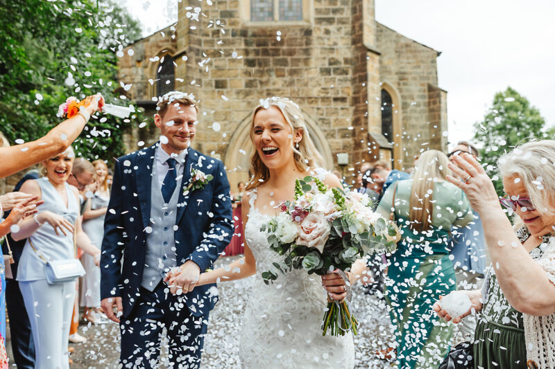 bride and groom outside cheshire church