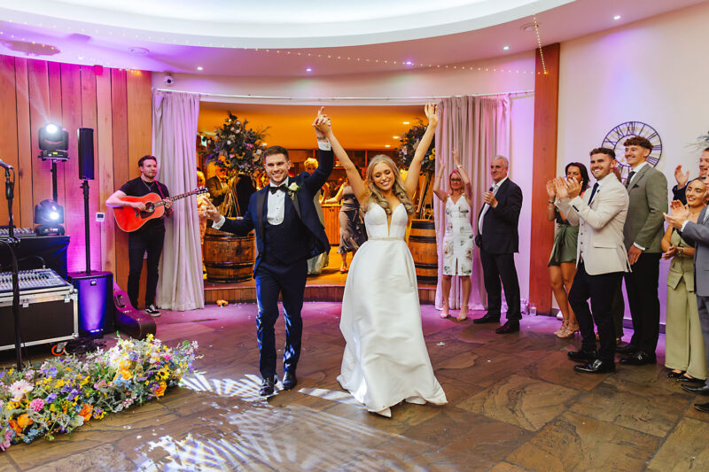 bride and groom entrance at the out barn clitheroe